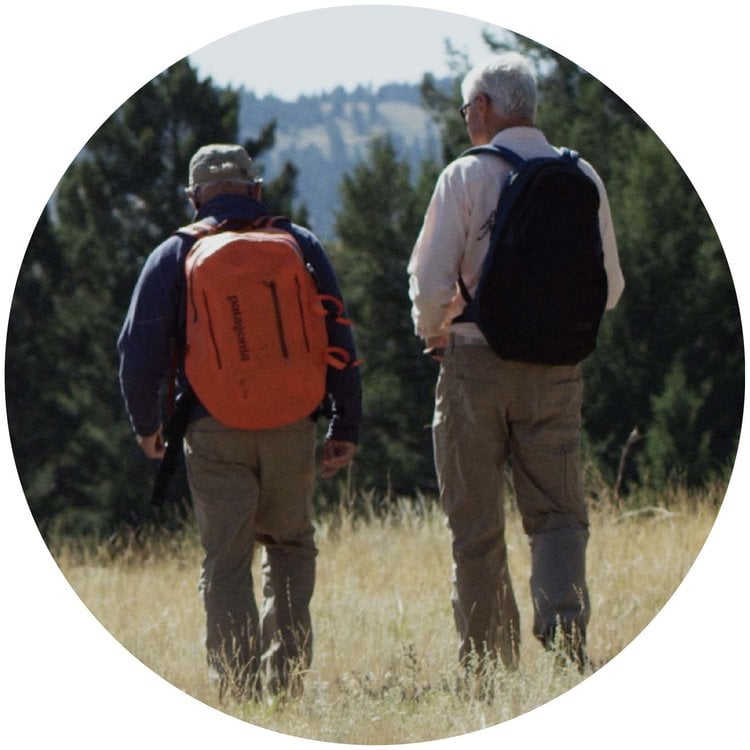 Two people walking outdoors