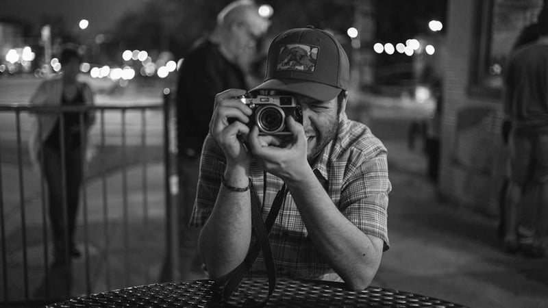 James Joiner sitting down and taking a photo